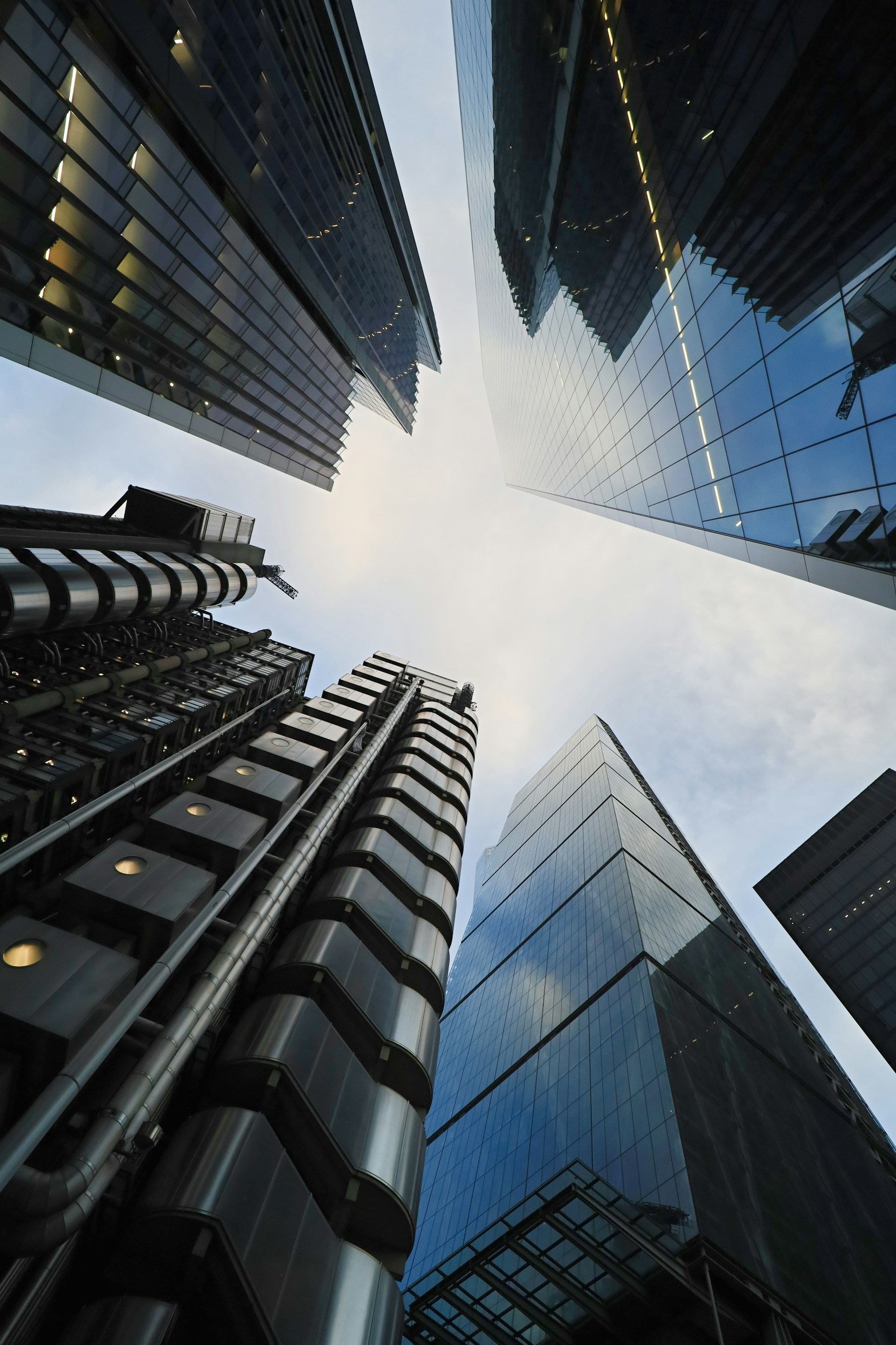 Glass office towers viewed from below against the sky